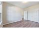 Comfortable bedroom features wood flooring and closet with double doors at 268 Stillbrook Dr., Longs, SC 29568