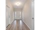 Bright entryway featuring wood-look flooring and a welcoming front door with sidelights at 268 Stillbrook Dr., Longs, SC 29568