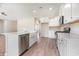 Updated kitchen boasting stainless steel appliances, an island with bar seating and a farmhouse sink at 268 Stillbrook Dr., Longs, SC 29568