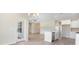 Bright kitchen with an island, stainless steel appliances, and a glass door providing plenty of natural light at 268 Stillbrook Dr., Longs, SC 29568