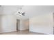 Spacious living room with vaulted ceilings, wood-look floors and modern ceiling fan at 268 Stillbrook Dr., Longs, SC 29568
