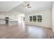 Open living space showcasing wood-look floors and abundant natural light at 268 Stillbrook Dr., Longs, SC 29568