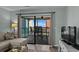 Inviting living room offering access to a cozy balcony with seating at 2700 S Ocean Blvd. # A-3, North Myrtle Beach, SC 29582