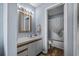 Bright bathroom with a single sink vanity, stylish mirror and shower/tub combo at 2700 S Ocean Blvd. # A-3, North Myrtle Beach, SC 29582