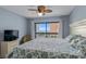 Bright bedroom with a ceiling fan and a balcony overlooking the ocean at 2700 S Ocean Blvd. # A-3, North Myrtle Beach, SC 29582
