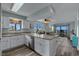 Updated kitchen with white cabinets, granite countertops, stainless appliances and view to living area at 2700 S Ocean Blvd. # A-3, North Myrtle Beach, SC 29582