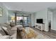 Cozy living room with access to the balcony, featuring comfortable sofa, stylish decor and beach view at 2700 S Ocean Blvd. # A-3, North Myrtle Beach, SC 29582