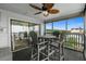 Inviting screened patio with seating, a ceiling fan, and relaxing views from the sliding glass doors at 2700 S Ocean Blvd. # A-3, North Myrtle Beach, SC 29582