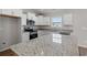 Modern kitchen featuring granite countertops, stainless steel appliances, and white cabinetry at 271 Stillbrook Dr., Longs, SC 29568
