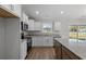Modern kitchen with stainless steel appliances, granite countertops, and a central island for food prep at 271 Stillbrook Dr., Longs, SC 29568