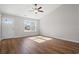 Inviting living room with wood flooring, a ceiling fan, and ample natural light at 271 Stillbrook Dr., Longs, SC 29568