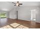 Open-concept living area featuring wood floors, neutral paint, and a ceiling fan at 271 Stillbrook Dr., Longs, SC 29568