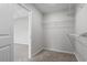 Walk-in closet with installed shelving and neutral walls and carpet at 271 Stillbrook Dr., Longs, SC 29568