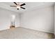 Spacious main bedroom featuring a ceiling fan, carpet flooring, and an en-suite bathroom at 275 Stillbrook Dr., Longs, SC 29568