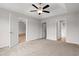 Spacious bedroom features a ceiling fan and doorways to the bathroom and another room at 275 Stillbrook Dr., Longs, SC 29568