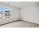 Bright bedroom featuring neutral carpet, a large window, and natural light at 275 Stillbrook Dr., Longs, SC 29568