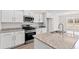 Modern kitchen featuring stainless steel appliances, granite countertops, and white cabinets at 275 Stillbrook Dr., Longs, SC 29568