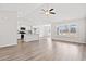 Bright, open-concept living space with hardwood floors, high ceilings, and modern kitchen with island at 275 Stillbrook Dr., Longs, SC 29568