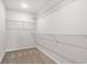 Carpeted walk-in closet featuring multiple shelves at 275 Stillbrook Dr., Longs, SC 29568