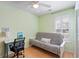 This light and airy bedroom features a futon and desk at 284 Nature Trail, Little River, SC 29566