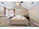 Cozy bedroom with neutral tones, a large bed, vaulted ceilings, and ample natural light at 284 Nature Trail, Little River, SC 29566
