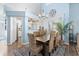 This dining area features vaulted ceilings and is open to the kitchen and living room at 284 Nature Trail, Little River, SC 29566