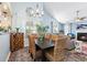 This dining area features vaulted ceilings and an open concept layout to the living room at 284 Nature Trail, Little River, SC 29566
