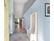 Inviting entryway with coat rack, light blue walls, and view into the living room with a fireplace at 284 Nature Trail, Little River, SC 29566