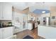 Bright kitchen with stainless steel appliances, granite countertops, and double french doors at 284 Nature Trail, Little River, SC 29566