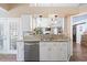 This open concept kitchen features granite countertops, stainless steel appliances, and eat in dining at 284 Nature Trail, Little River, SC 29566