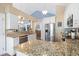 Bright kitchen with stainless steel appliances, granite countertops, and breakfast bar at 284 Nature Trail, Little River, SC 29566