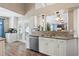 Modern kitchen showcasing granite countertops, white cabinets, stainless steel appliances, and wood-look flooring at 284 Nature Trail, Little River, SC 29566