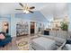 Spacious living area with a vaulted ceiling, stylish decor, and comfortable seating arrangement at 284 Nature Trail, Little River, SC 29566
