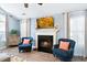 Comfortable living room with a fireplace and hardwood floors and vaulted ceilings at 284 Nature Trail, Little River, SC 29566