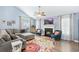 Cozy living room with fireplace, plush seating, vaulted ceilings, and stylish decor at 284 Nature Trail, Little River, SC 29566