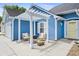 Cozy patio area featuring a pergola, comfortable seating, and a charming outdoor setting with a decorative window at 284 Nature Trail, Little River, SC 29566