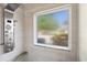 Modern shower with a rainfall showerhead, seat, and window for natural light at 284 Nature Trail, Little River, SC 29566
