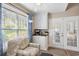 Cozy sitting area with storage and double french doors at 284 Nature Trail, Little River, SC 29566