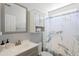 Well-lit bathroom featuring modern fixtures, including a vanity and shower, complemented by stylish decor and ample storage at 3136 Robins Nest Way, Myrtle Beach, SC 29579