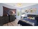 Comfortable bedroom with a serene ambiance, featuring contemporary furnishings, natural light, and stylish decorative accents at 3136 Robins Nest Way, Myrtle Beach, SC 29579