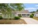 Charming one-story home with a welcoming front porch and manicured landscaping at 3136 Robins Nest Way, Myrtle Beach, SC 29579