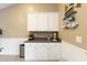 Coffee bar in kitchen, features white cabinets, coffee bar sign, decorative mugs and a neutral backsplash at 3136 Robins Nest Way, Myrtle Beach, SC 29579