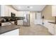 Bright, open kitchen with stainless steel appliances, white cabinets, and views of the breakfast area and backyard at 3136 Robins Nest Way, Myrtle Beach, SC 29579