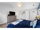 Bright main bedroom featuring vaulted ceiling, ceiling fan and a large dresser with mounted TV at 3136 Robins Nest Way, Myrtle Beach, SC 29579