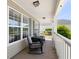 Cozy front porch with comfortable seating, perfect for relaxing and enjoying the outdoors at 3136 Robins Nest Way, Myrtle Beach, SC 29579
