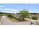 A street view of a charming house with lush landscaping, mature trees, and curb appeal at 3136 Robins Nest Way, Myrtle Beach, SC 29579