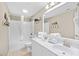 Bathroom with a double vanity, shower and tub combo, and beach themed decor at 3401 N Ocean Blvd. # 309, North Myrtle Beach, SC 29582