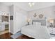 Nautical themed bedroom with a queen bed, wood floors, and coastal decor at 3401 N Ocean Blvd. # 309, North Myrtle Beach, SC 29582