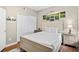 Comfortable bedroom with wood floors, complemented by golf-themed artwork, and a closet for storage at 3401 N Ocean Blvd. # 309, North Myrtle Beach, SC 29582