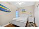 Bright bedroom with a queen bed, wood floors, and beach themed decor at 3401 N Ocean Blvd. # 309, North Myrtle Beach, SC 29582